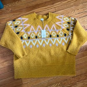 Never worn women’s XL polyester sweater.